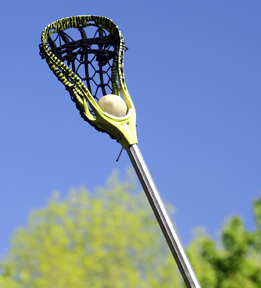 This is a picture of a lacrosse stick and ball.