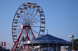 This is a photo of a Ferris wheel and a merry-go-round.