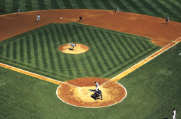 This is a photo of the infield of a baseball diamond. Players are on the field and are playing baseball.