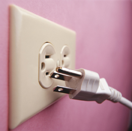 This photo shows an electrical outlet and the electrical plug that matches the outlet.