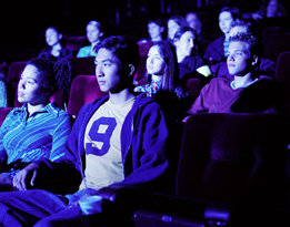 This is a photo of people watching a movie in a movie theatre.