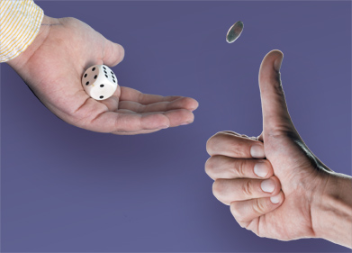 This image shows a hand flipping a coin and another hand rolling a die. 