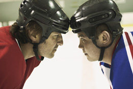 This is a photo of two hockey players staring at each other.