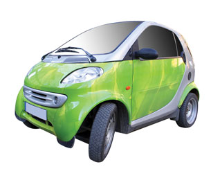 The photo shows a green Smart car.