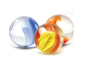 A photograph shows three coloured marbles.