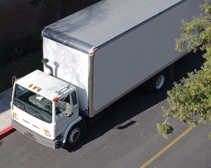 A photo shows a transport truck driving on the road.