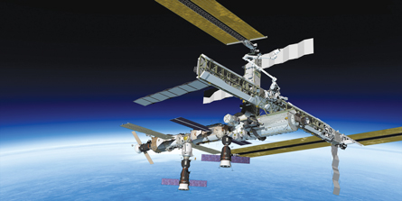 A photograph shows the International Space Station. 