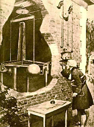 An image shows Henry Cavendish looking through a hole in a brick wall at a torsion balance.