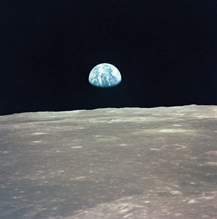 Earth is shown appearing above the horizon of the Moon.