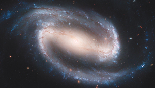A universe, with light shaped in the formation of a spiral, is shown in the image.