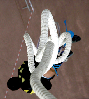 A photograph shows a bungee jumper and his bungee cord.