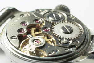 A photograph shows the inside of a wristwatch.