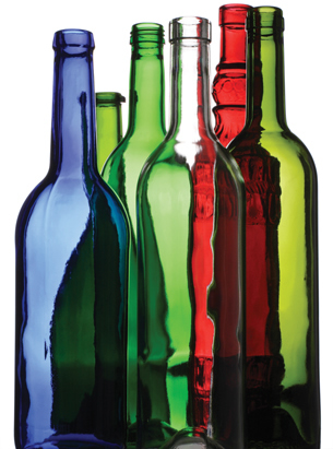 A photograph shows six long-neck glass bottles: one clear, one red, one blue, and three green.