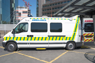 A photograph shows a parked ambulance.